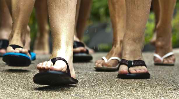 men's feet in flip flops